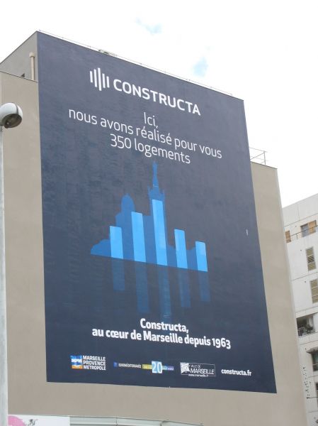 Pose d'un visuel très grand format sur mur de bâtiment  pour Constructa à Marseille